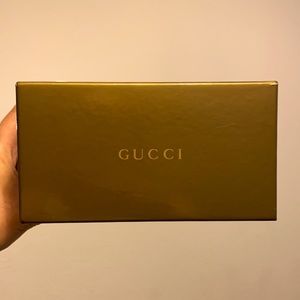 GUCCI SUN-GLASSES!!! They are brown with gold sides. Wasp in the center.